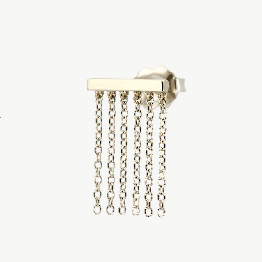 Gold earring with dangling chains on a white background