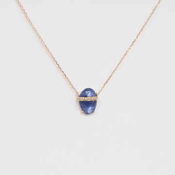 Necklace with a blue pendant on a light gray background