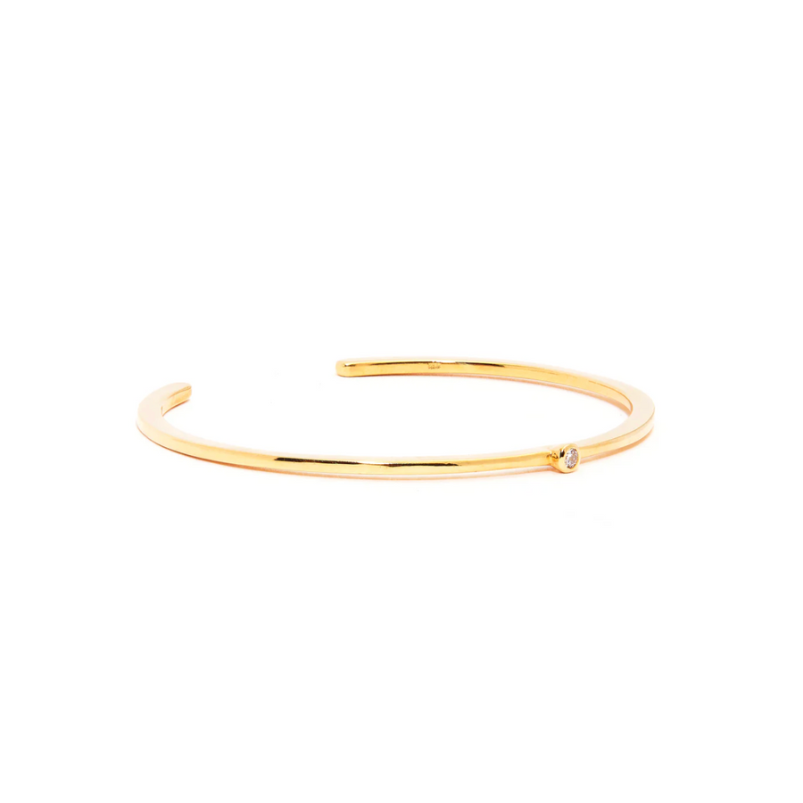 Gold bracelet on a white background