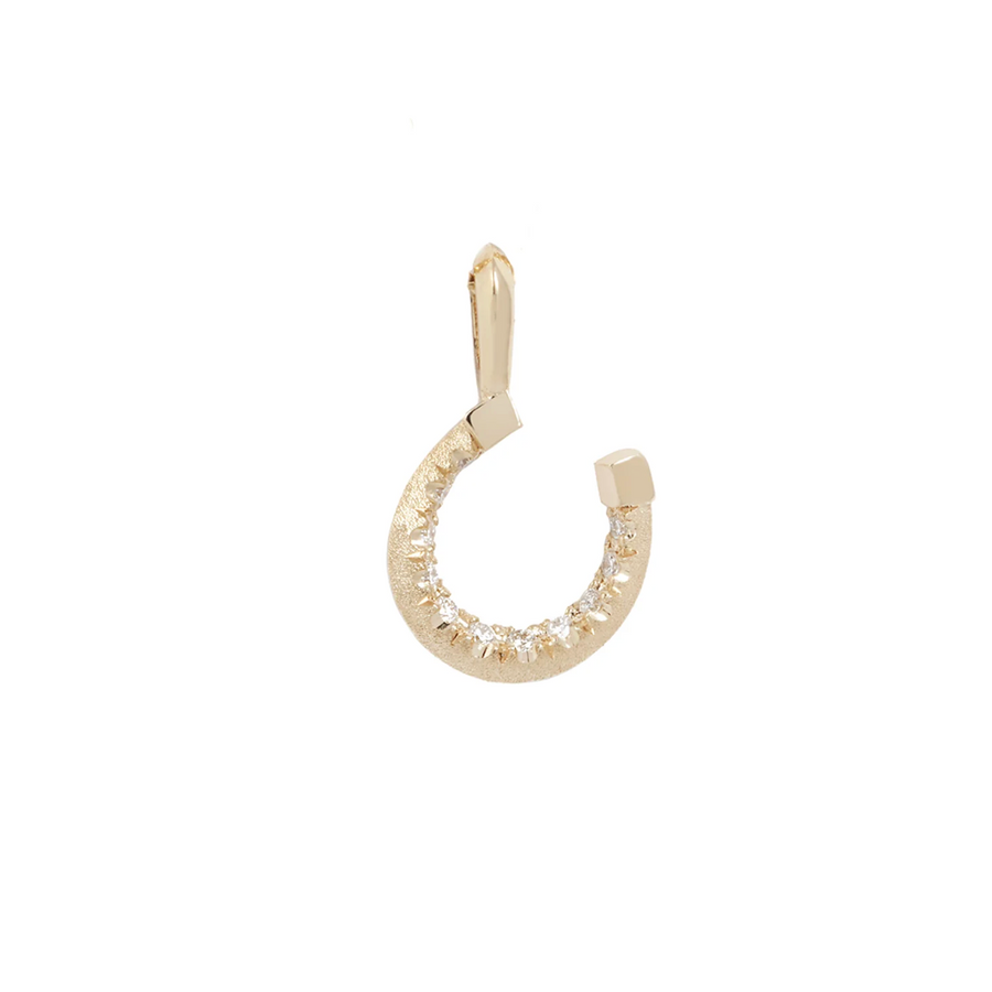 Gold earring on a white background