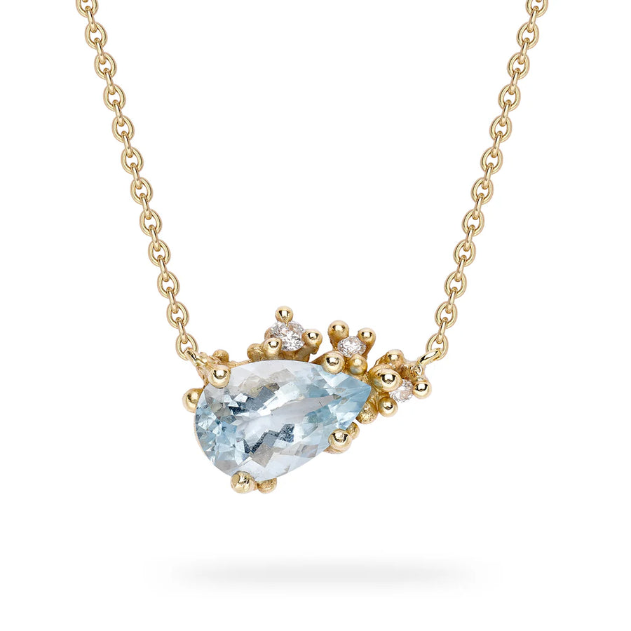 Pear shaped aquamarine pendant encrusted with our signature golden granule details punctuated with white diamonds diamonds, on a delicate link chain with a bolt clasp. 