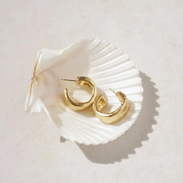 Thick brass hoops on studs