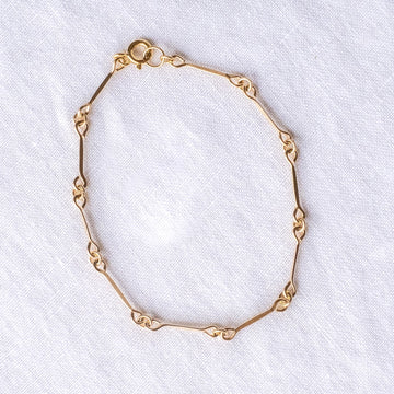 gold filled hammered bars with links on each end, connected to make a bracelet 