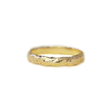 wide gold band with a lot of texture
