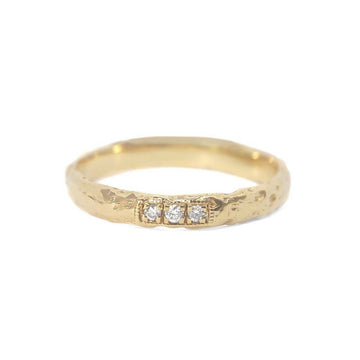 The Tri-Diamond wide band ring features 3 sparkling pavé set diamonds with vintage milgrain detail