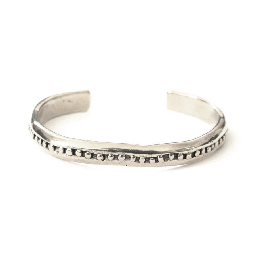 Cuff with inlaid granulation detailing. 2.5 inches in diameter.