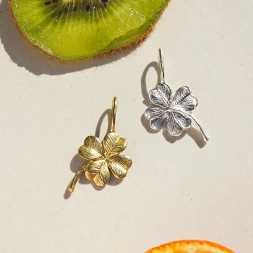 Brass and silver four leaf clover charms 