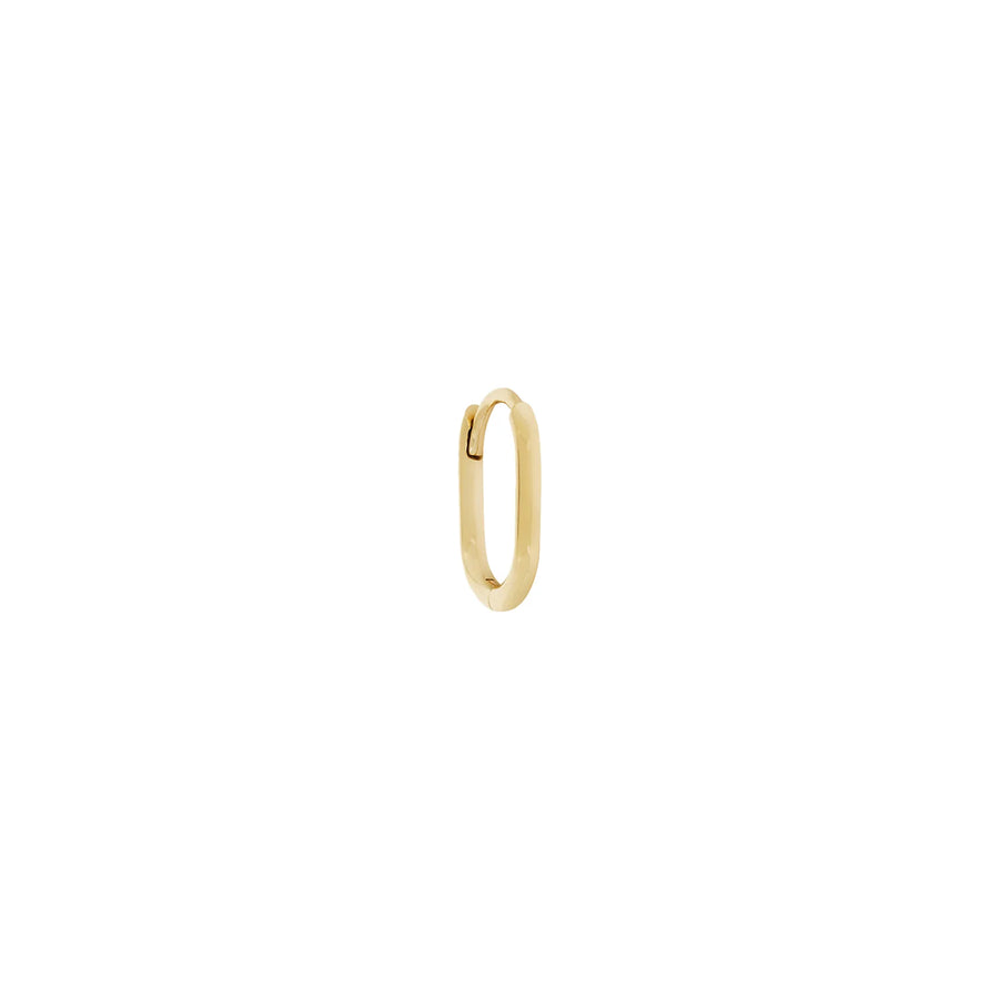 Gold hoop earring on a white background