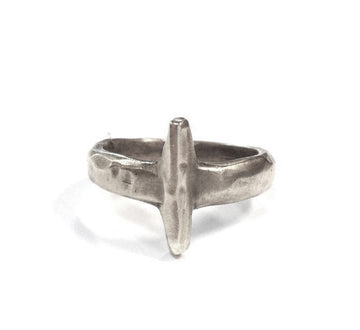 Silver ring with a unique design on a white background