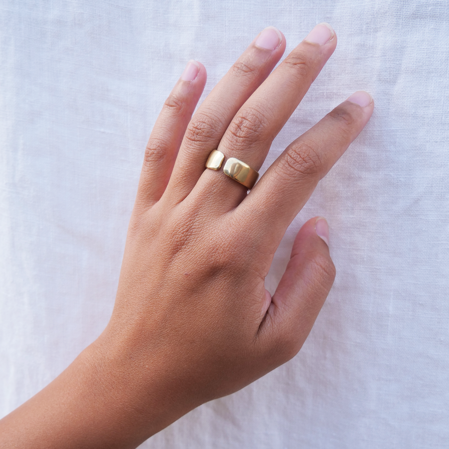 Wide band ring with subtle and slight natural texturing.  Opening allows the ring to be manipulated to be more open or closed for different sizing, on model - Marisa Mason Jewelry