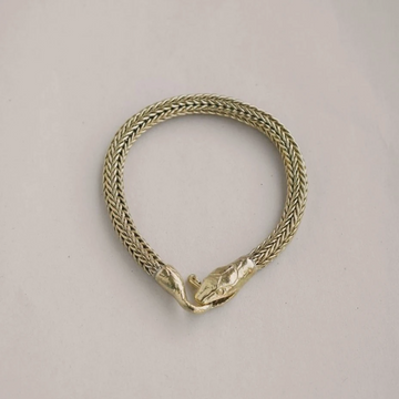 Brass bracelet made of wheat chain with a snakes head biting its own tail as the clasp
