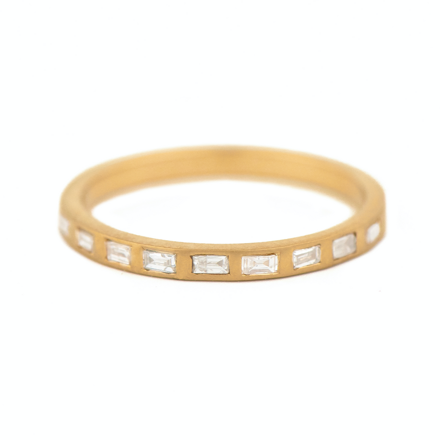 Celine Daoust 14k ring with white baguette diamonds flush set all around the band. wedding band gold engagement ring