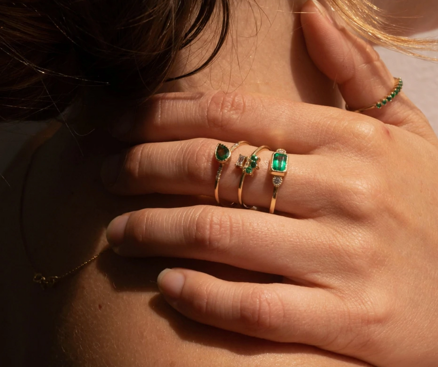 Jennie Kwon Designs emerald cut emerald ring two round diamonds alternative engagement ring