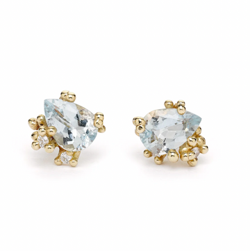 Pear shaped aquamarine studs encrusted with our signature golden granules and white diamonds