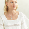 2 of 6: Necklace made of round link chain with toggle clasp, with heart pendant the drops down, in silver on model- Marisa Mason Jewelry-Marisa Mason Jewelry