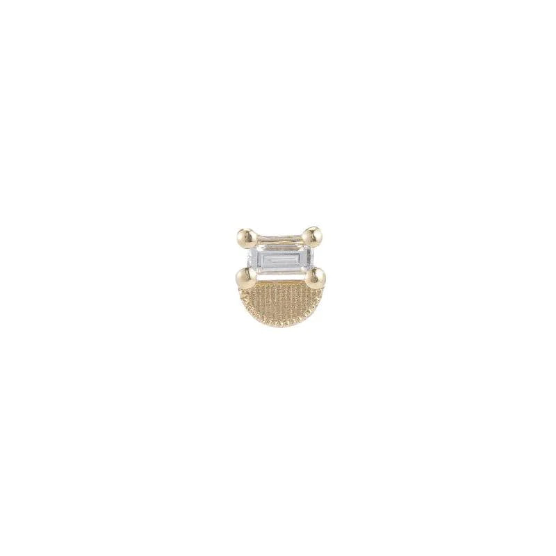 A pristine baguette diamond prong set atop a soft geometric half moon gold crescent, to create the perfect balance of edges and curves.  Hand implemented milgrain detail around the perimeter of the half moon.
